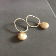 Swinging pearl - amorphous shaped silver earring with large moving pearl - designer jewelry