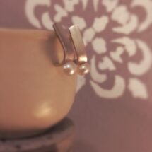 Curved pearl - stud silver earrings